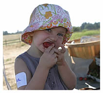 Elisa eating chocolate-covered strawberry