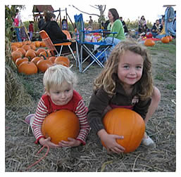 Elisa and friend with pumpkins