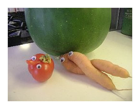 Goofy tomato with nose and two-legged carrot