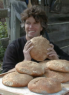Tom and fresh loaves of bread