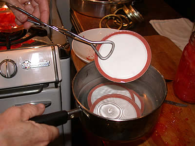 Withdrawing lid from hot water
