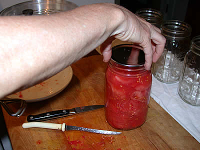 Setting lid on jar